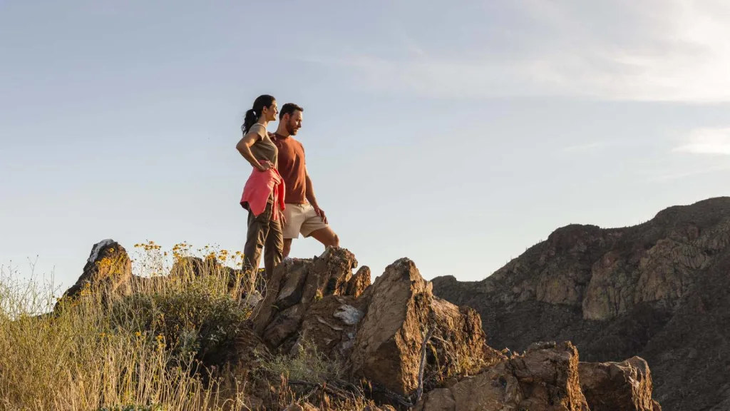 Castle Hot Springs couple hiking on wellness retreat